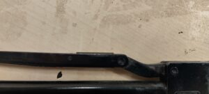 Delrin slipper plate installed in cocking link